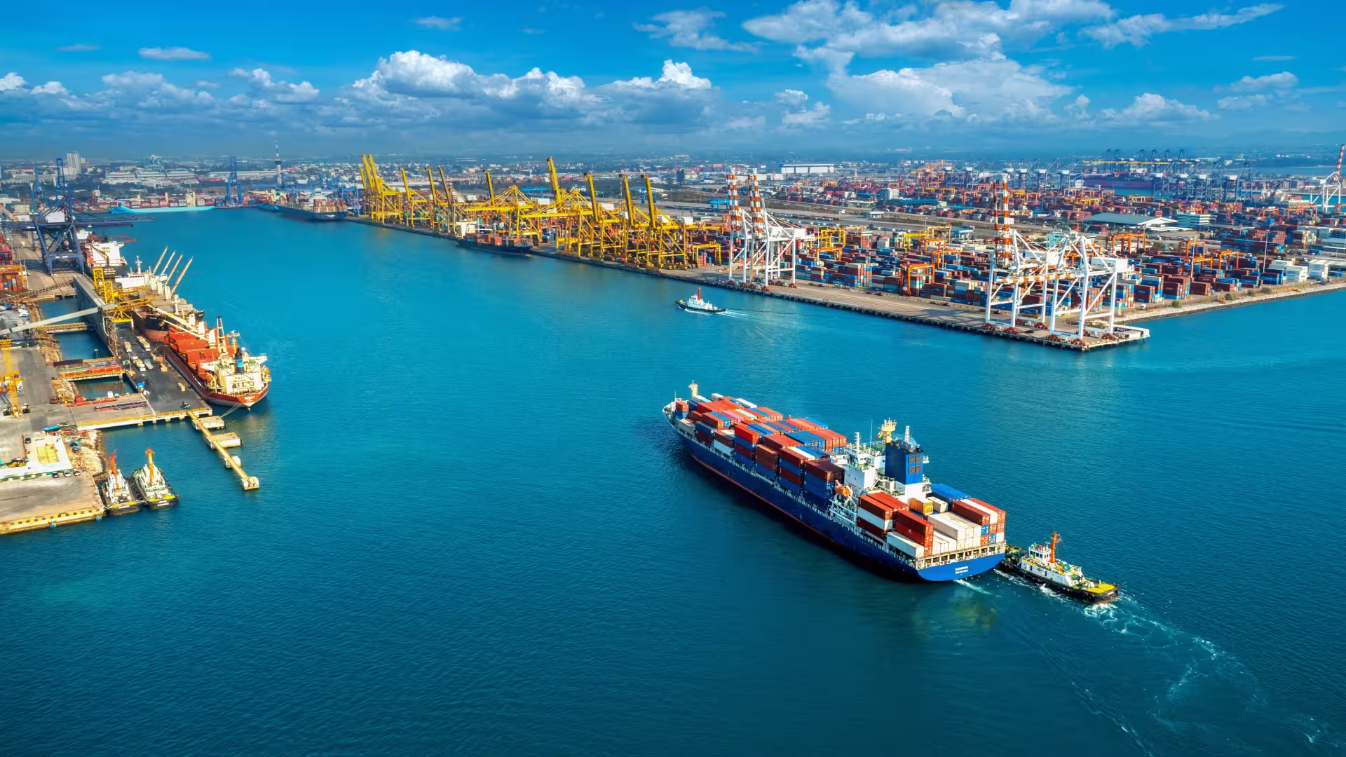 Shipping container moving into port to drop of cargo